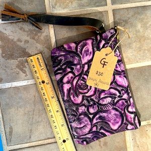 Handmade purple floral leather clutch.